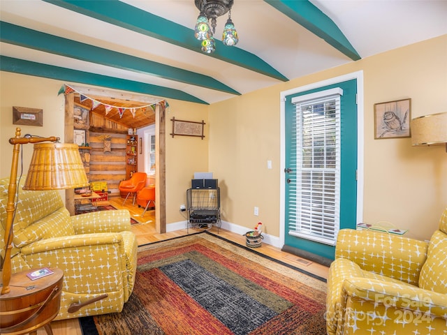 living room with lofted ceiling and hardwood / wood-style flooring