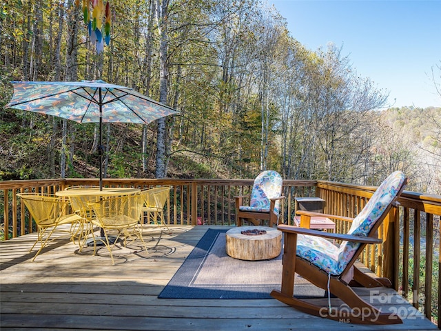 deck with an outdoor fire pit