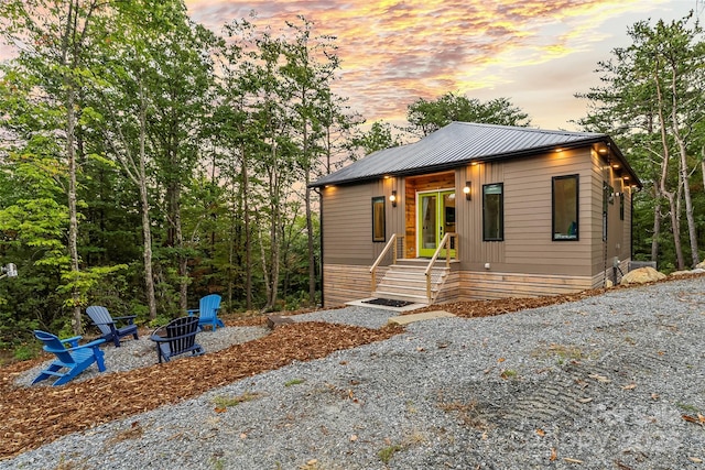 view of front facade with a fire pit