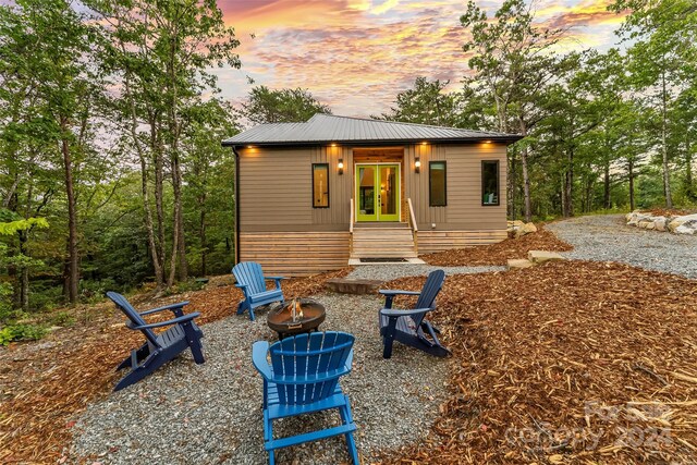 exterior space with an outdoor fire pit