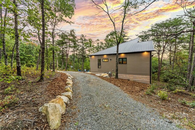 view of property exterior at dusk