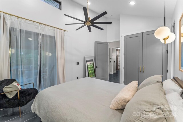 bedroom featuring ceiling fan and high vaulted ceiling