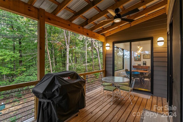 sunroom / solarium with lofted ceiling and ceiling fan