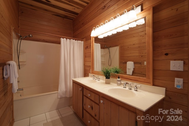 bathroom featuring shower / bath combo, vanity, wood walls, and tile patterned floors