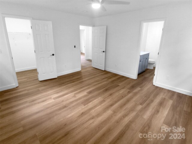 interior space with light hardwood / wood-style flooring and ceiling fan