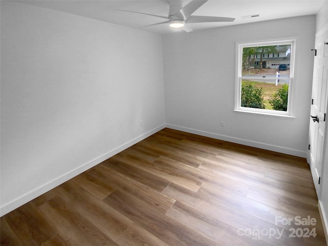 empty room featuring light hardwood / wood-style flooring and ceiling fan