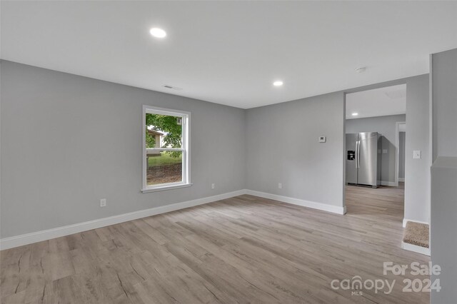 empty room with light wood-type flooring