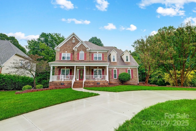 craftsman inspired home with a front lawn and covered porch