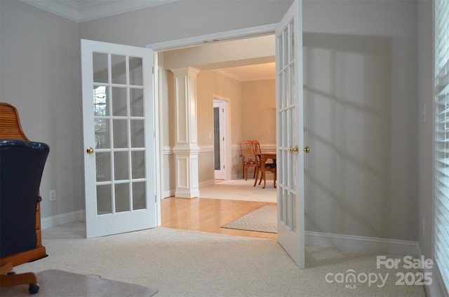 office with decorative columns, ornamental molding, and french doors