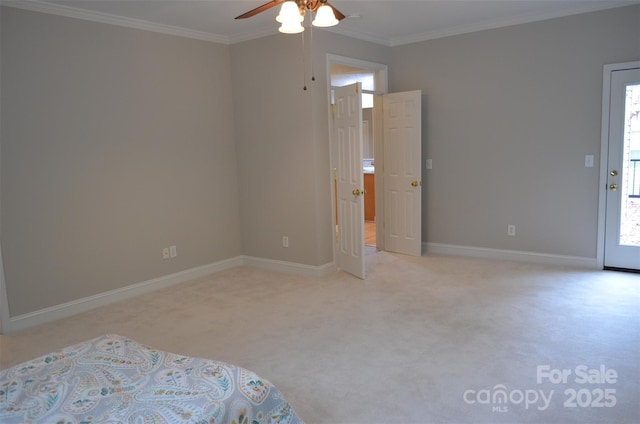 unfurnished bedroom with ceiling fan, crown molding, and light carpet