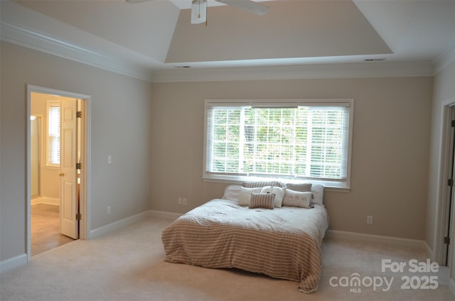 bedroom featuring light colored carpet, a raised ceiling, ceiling fan, and crown molding