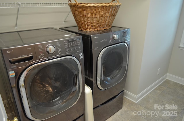 laundry area featuring washing machine and clothes dryer