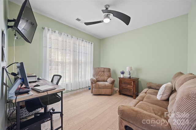 office area with light hardwood / wood-style floors and ceiling fan