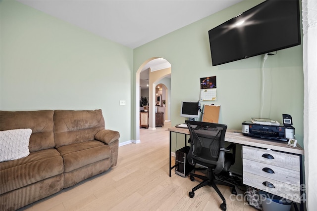 office with light hardwood / wood-style flooring