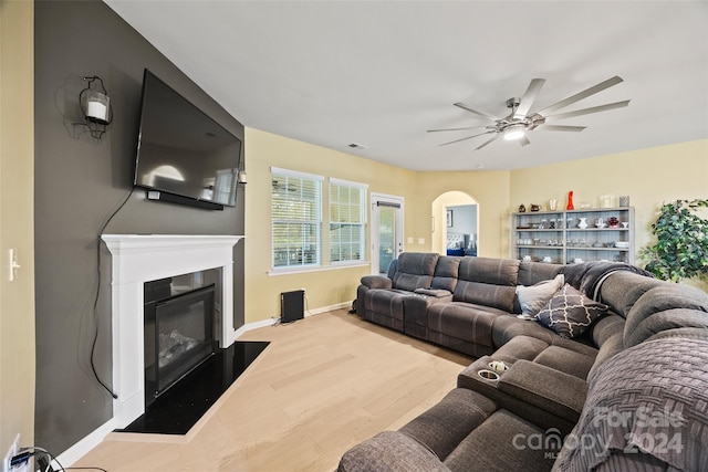 living room with ceiling fan and hardwood / wood-style floors