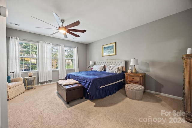 bedroom with light colored carpet and ceiling fan