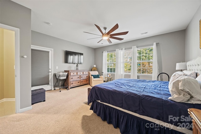 carpeted bedroom with ceiling fan