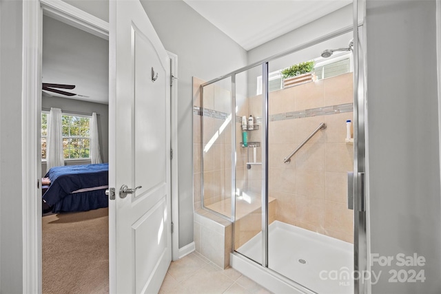 bathroom featuring walk in shower, tile patterned floors, and ceiling fan