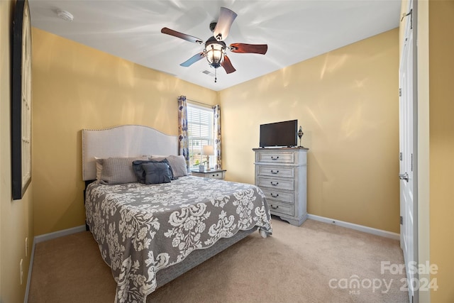 carpeted bedroom featuring ceiling fan