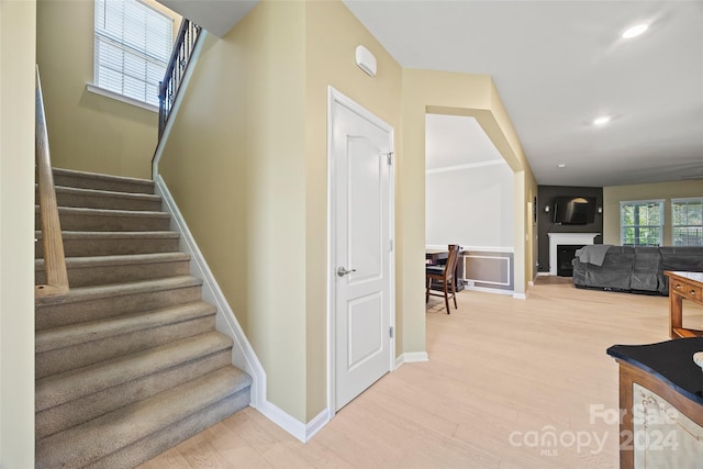 staircase featuring hardwood / wood-style floors