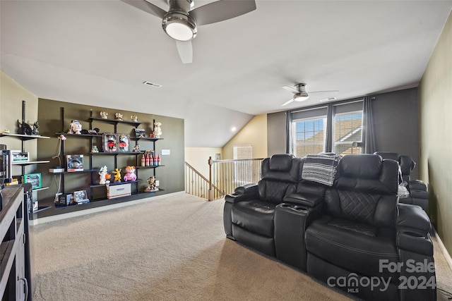 cinema with vaulted ceiling, carpet floors, and ceiling fan