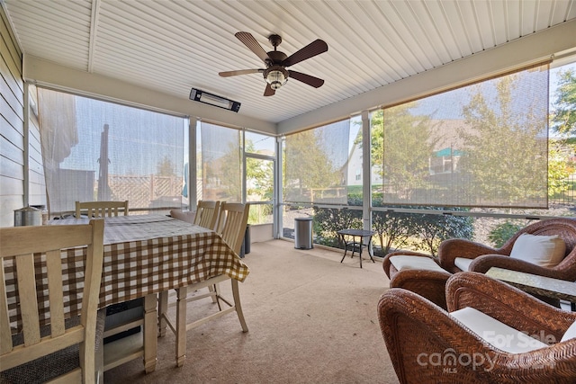 sunroom featuring ceiling fan