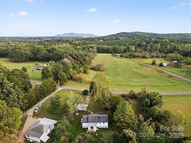 drone / aerial view featuring a mountain view and a rural view