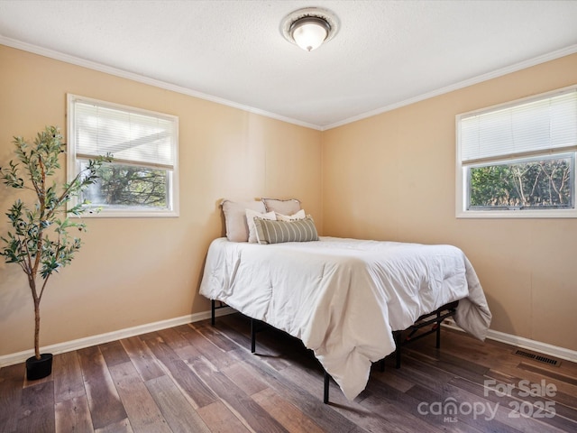 bedroom with hardwood / wood-style flooring and ornamental molding