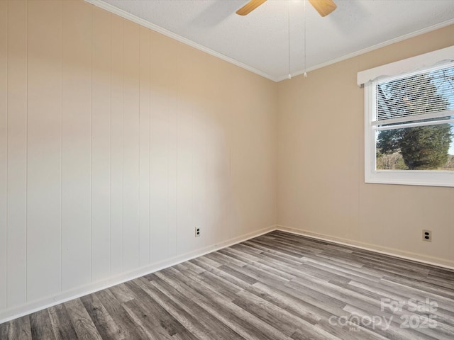 spare room with ceiling fan, crown molding, wood-type flooring, and a textured ceiling