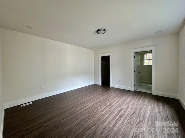 spare room featuring dark hardwood / wood-style floors