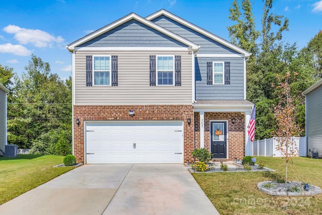 view of front of house with a garage, central AC, and a front lawn