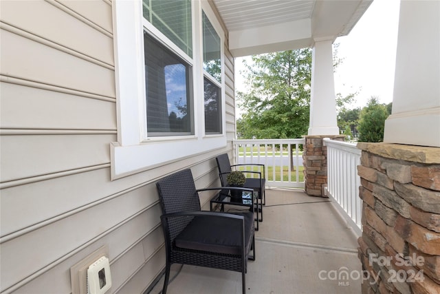 view of patio featuring a porch