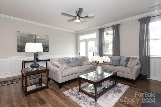 living room featuring ceiling fan, crown molding, and dark wood-type flooring