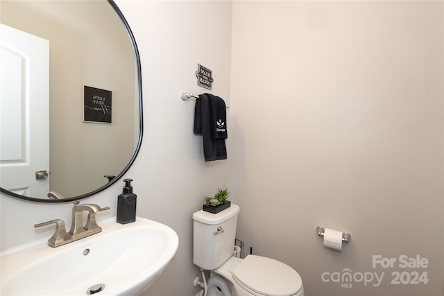 bathroom with sink and toilet