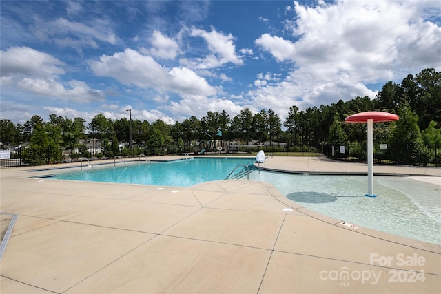 view of swimming pool featuring a patio