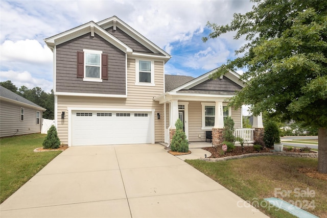 craftsman-style home with a garage and a front lawn