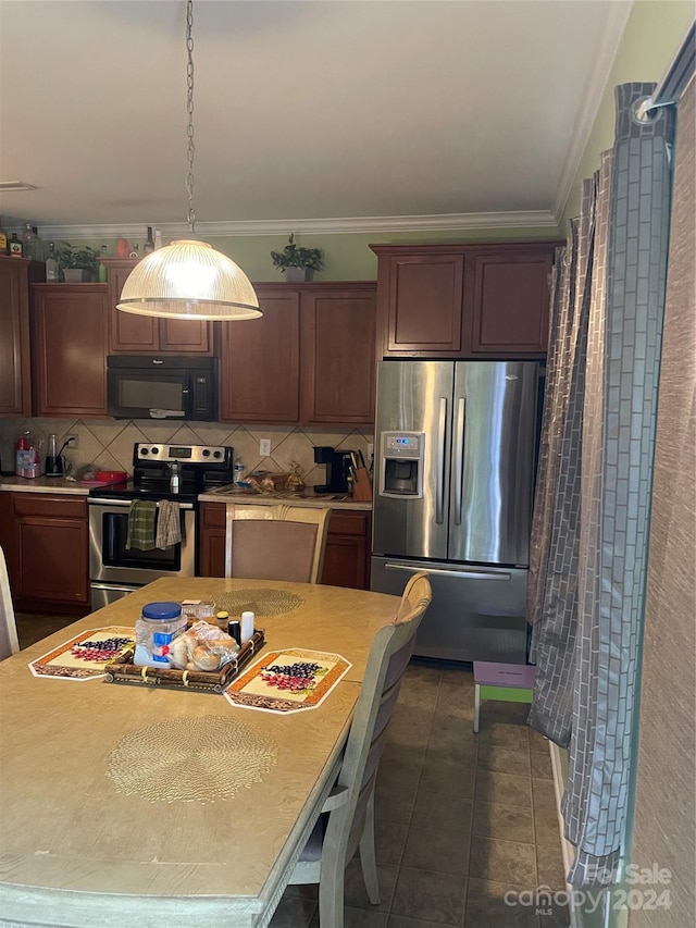 kitchen with dark brown cabinetry, ornamental molding, decorative light fixtures, backsplash, and stainless steel appliances