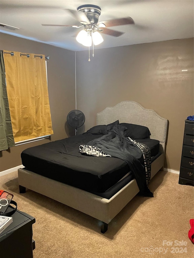 carpeted bedroom with ceiling fan