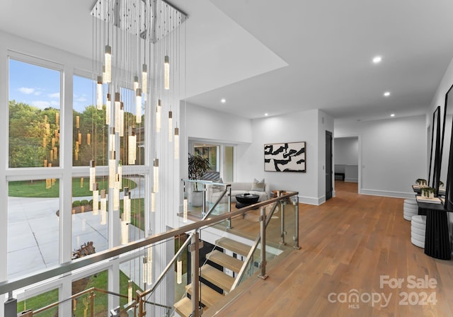 hallway with hardwood / wood-style floors