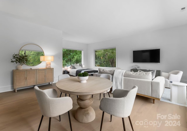 dining area with dark hardwood / wood-style flooring