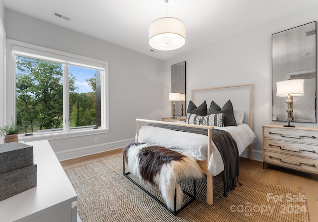 bedroom with light hardwood / wood-style flooring