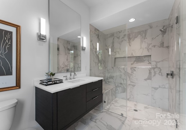 bathroom with an enclosed shower, vanity, and toilet