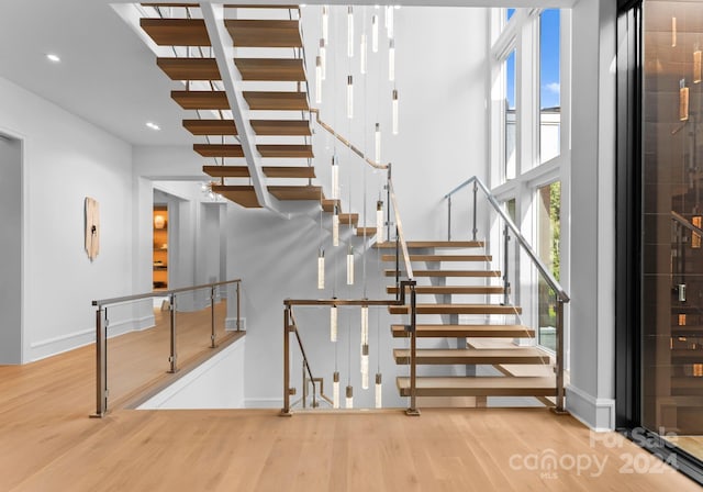 staircase featuring hardwood / wood-style floors