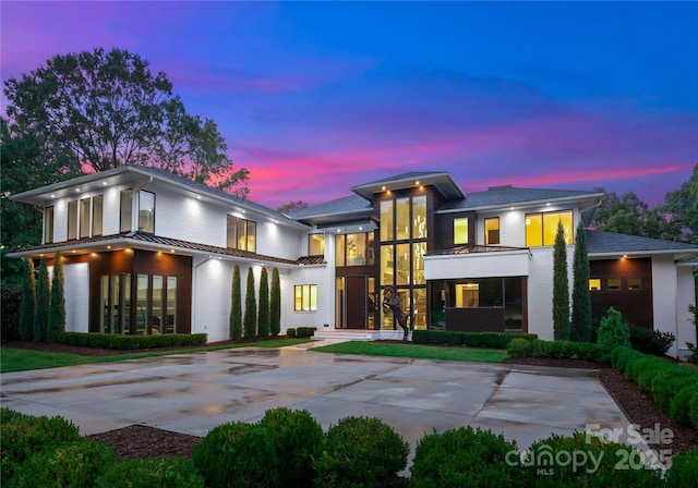 2116 Woodhaven Rd, Charlotte, NC 28211 - view of front facade with metal roof and a standing seam roof