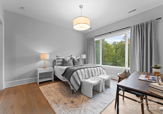 2116 Woodhaven Rd, Charlotte, NC 28211 - bedroom with baseboards, visible vents, and wood finished floors