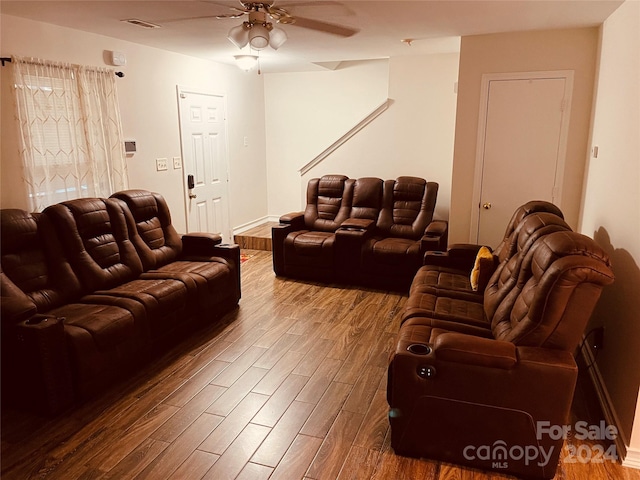 living room with ceiling fan and hardwood / wood-style flooring