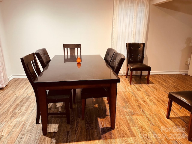 dining room featuring light hardwood / wood-style flooring