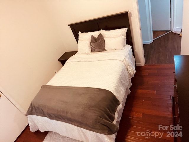 bedroom featuring dark hardwood / wood-style flooring