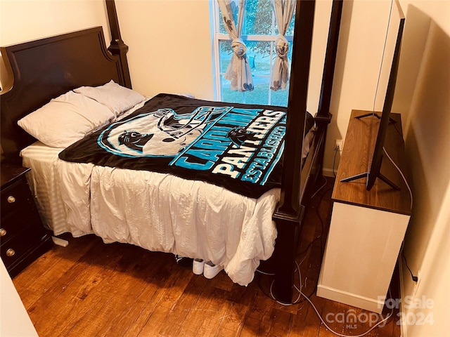 bedroom featuring dark hardwood / wood-style floors