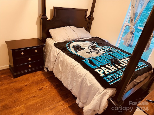 bedroom featuring dark hardwood / wood-style floors